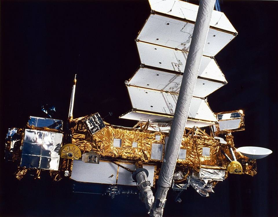 The UARS satellite held by the shuttle arm during STS-48, September 1991