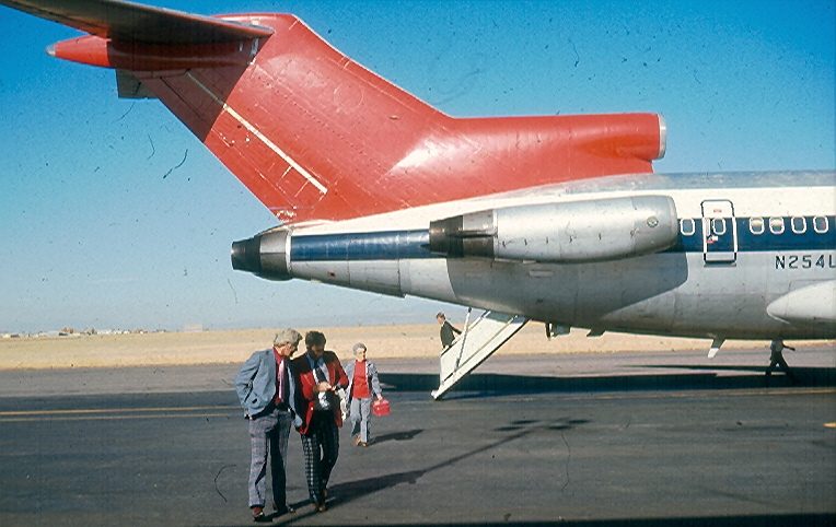 A Northwest Orient Boeing 727 on the ground in 1975 with the rear airstair lowered under its tail