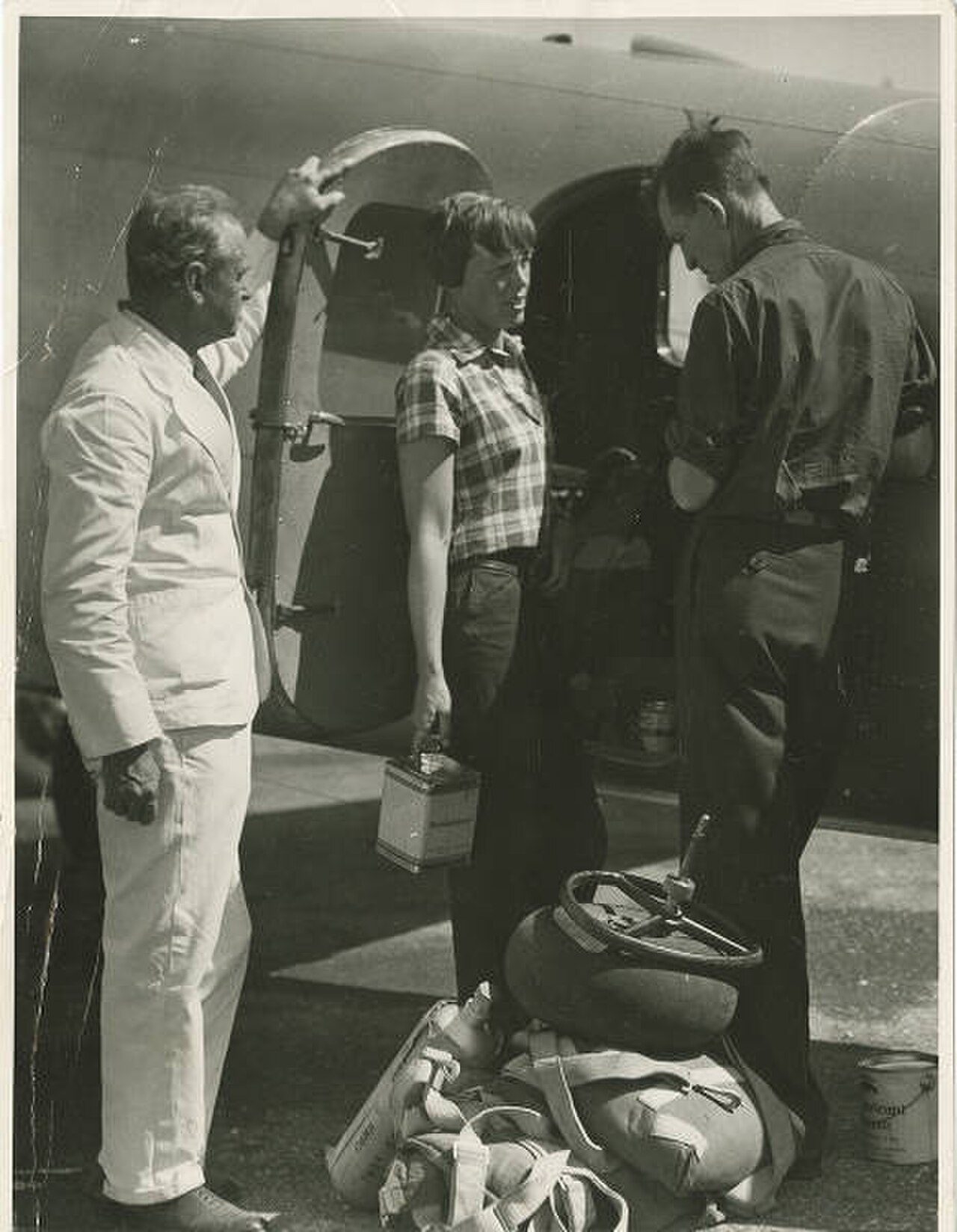 Black and white photograph of Amelia Earhart and Fred Noonan beside the Lockheed Electra at Darwin, Australia, 28 June 1937.